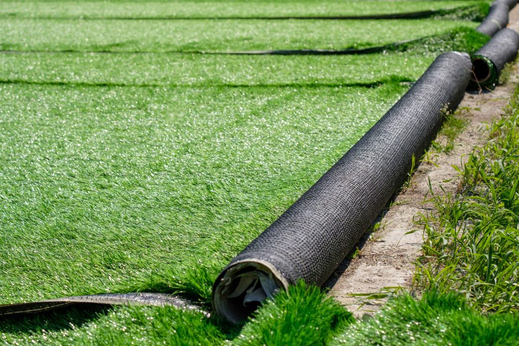 how to lay artificial grass on soil