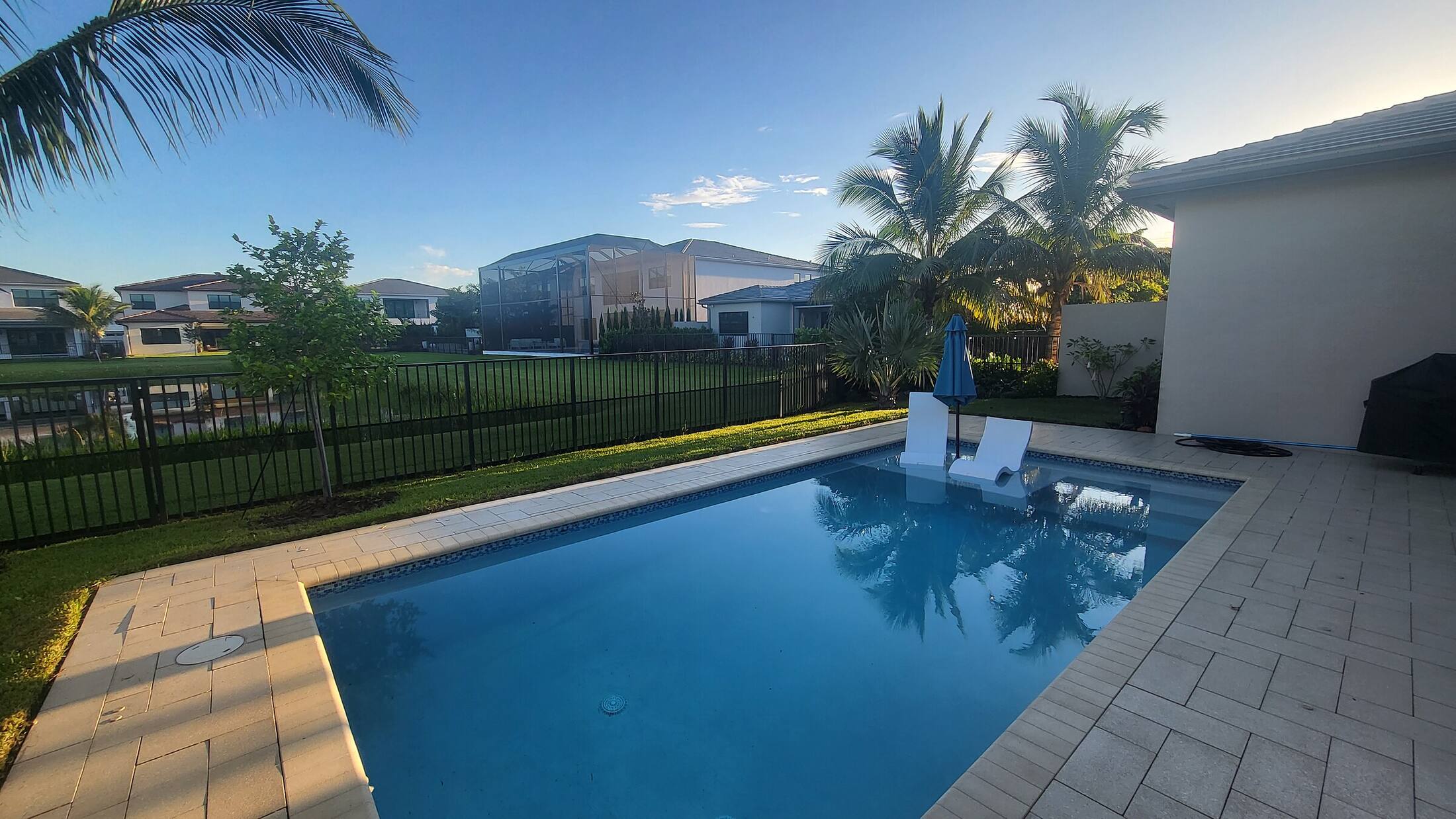 Artificial turf around a pool deck